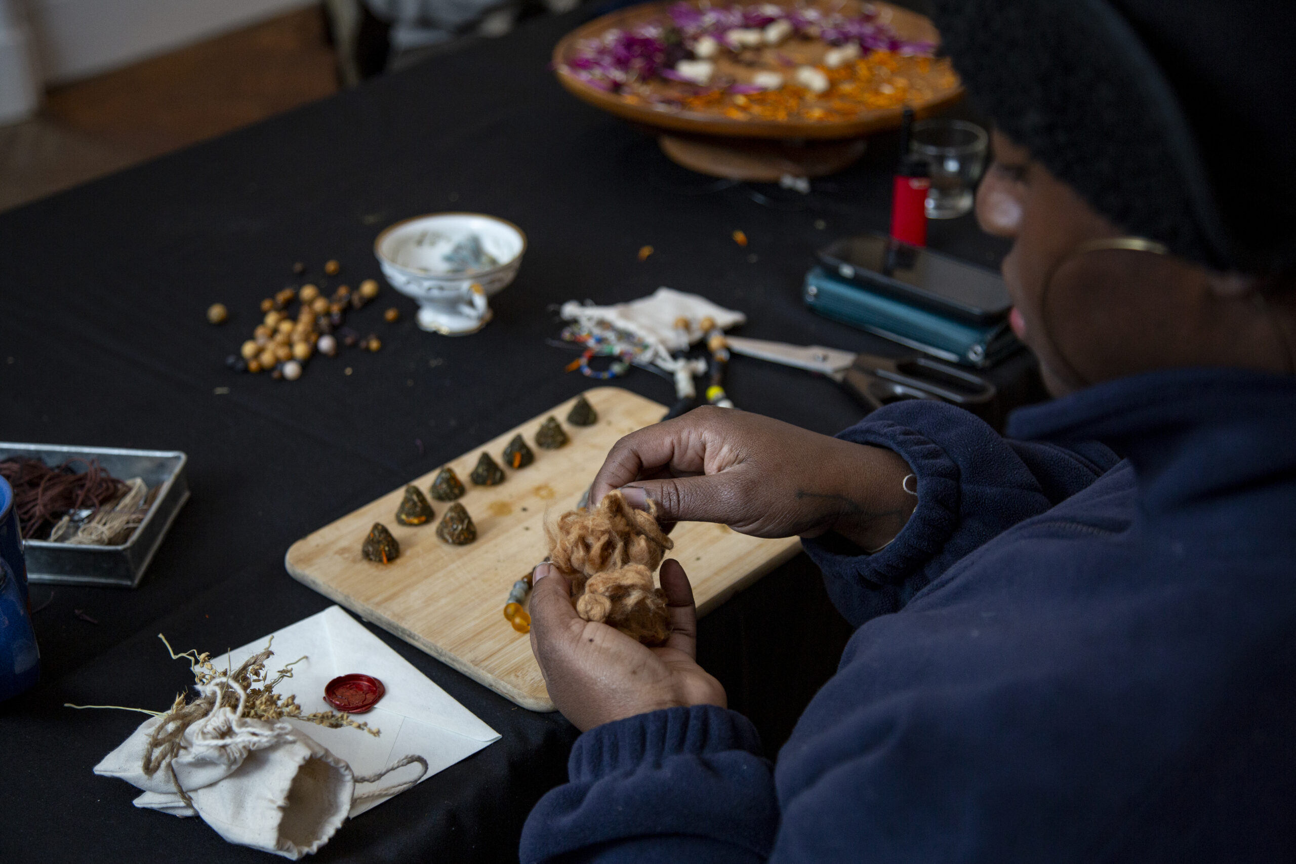 Karina Sharif crafts homemade incense cones. Photo by Billy Chen.