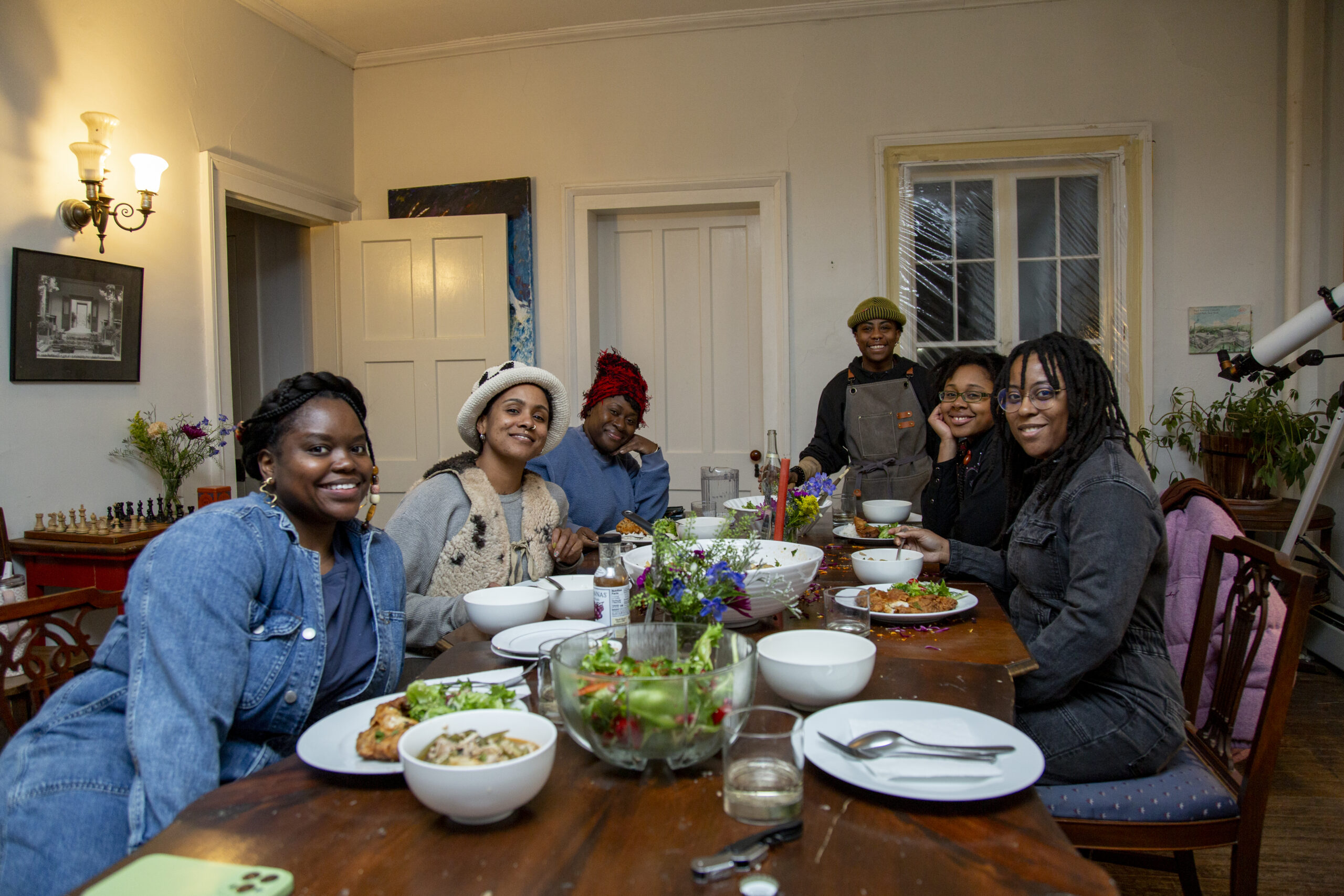 The homemade field of love cohort gathers around a feast led by Spirit Adams. Photo by Billy Chen at Arts Letters & Numbers.